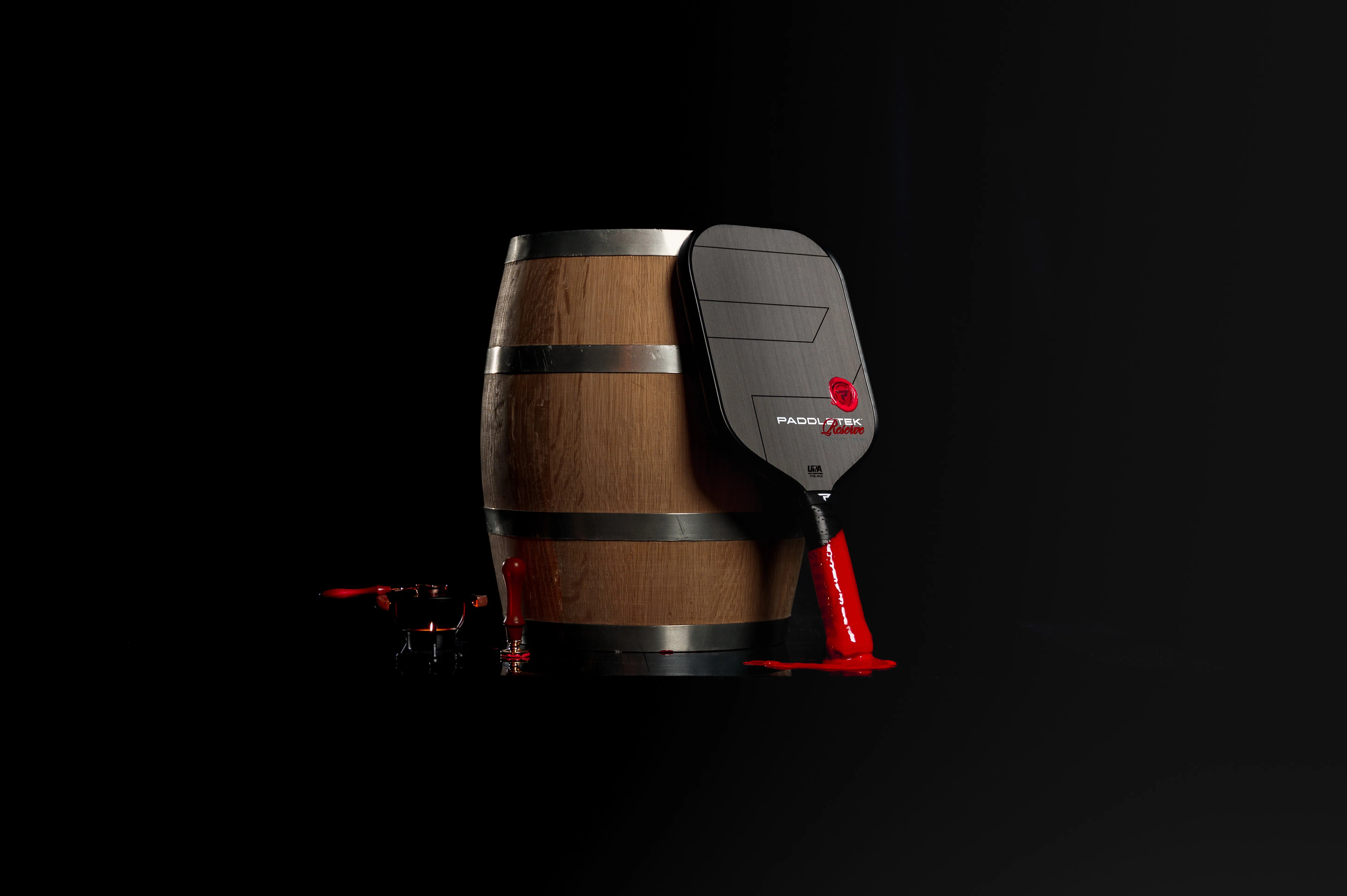 Paddle resting by a barrel